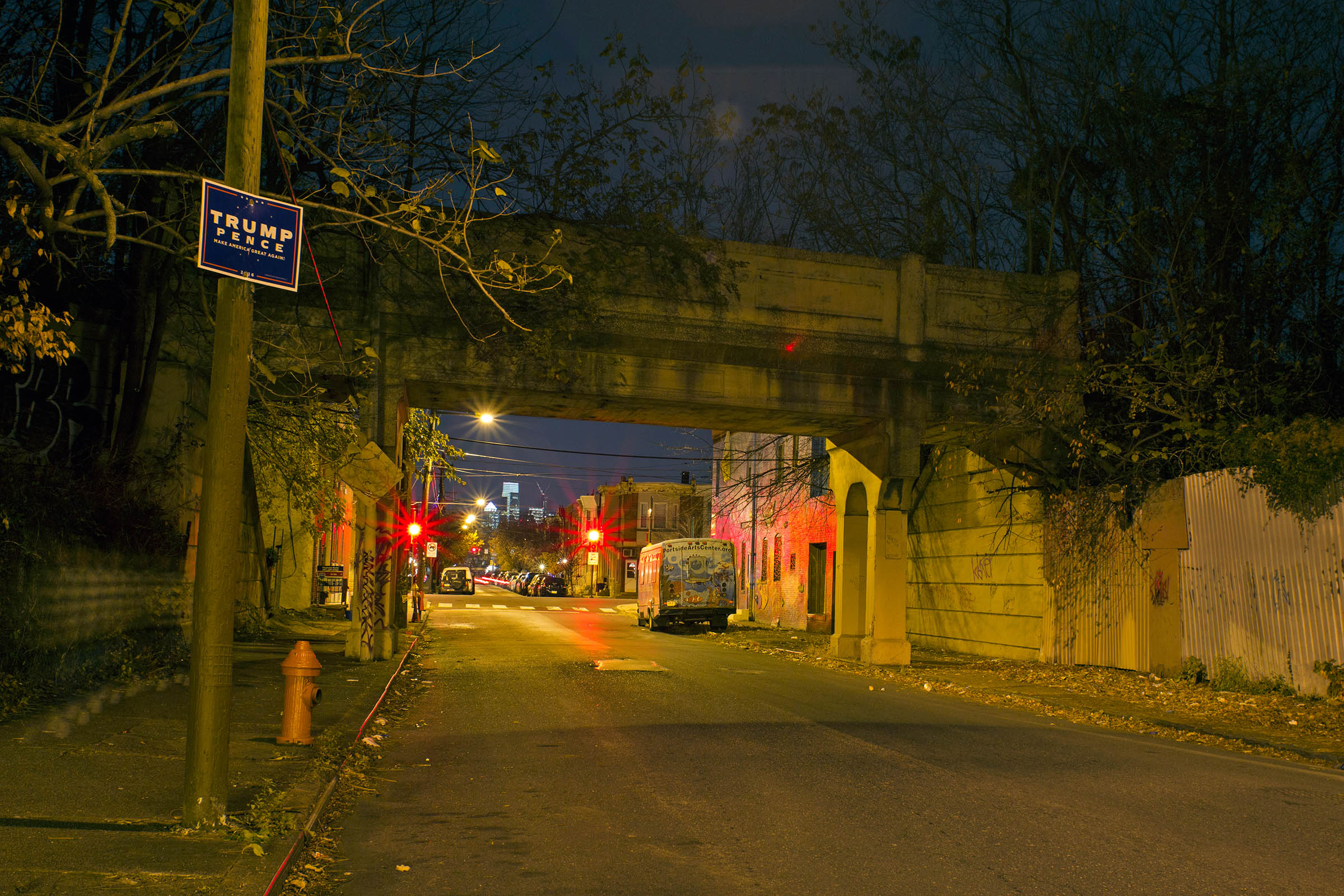 Trump-Pence 2016 campaign sign features in this streetscape from Port Richmond, Philadelphia, USA, 2017.